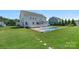 Large, fenced backyard featuring a pool, green lawn, deck, and gazebo at 708 Brookmeade Dr, Waxhaw, NC 28173