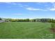 Vast lawn with well-maintained greenery, offering ample space for recreation and leisure activities at 708 Brookmeade Dr, Waxhaw, NC 28173