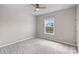 Clean, carpeted bedroom with ceiling fan and window with outside view at 708 Brookmeade Dr, Waxhaw, NC 28173