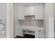 Convenient desk area with upper and lower cabinets plus stylish backsplash at 708 Brookmeade Dr, Waxhaw, NC 28173