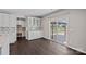 Bright dining area features modern cabinetry, a tiled backsplash, and sliding glass doors to the deck at 708 Brookmeade Dr, Waxhaw, NC 28173