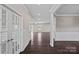 Inviting entryway with dark hardwood floors and elegant white trim at 708 Brookmeade Dr, Waxhaw, NC 28173