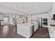 Open-concept kitchen with white cabinets, an island, and stainless steel appliances at 708 Brookmeade Dr, Waxhaw, NC 28173