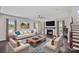 Comfortable living room with fireplace, ceiling fan, and plenty of natural light at 708 Brookmeade Dr, Waxhaw, NC 28173