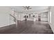 Bright, open floorplan featuring kitchen, living and dining areas, plus hardwood floors and white cabinets at 708 Brookmeade Dr, Waxhaw, NC 28173