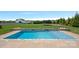 Relaxing backyard in ground pool with manicured lawn, great for entertaining guests at 708 Brookmeade Dr, Waxhaw, NC 28173