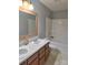 Bathroom featuring a double sink vanity, and shower-tub combo at 7113 Sycamore Grove Ct, Charlotte, NC 28227