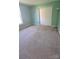 Cozy bedroom with carpet flooring, closet, and a bright window at 7113 Sycamore Grove Ct, Charlotte, NC 28227