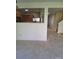 Partial view of the eat-in kitchen with stainless steel appliances and access to an adjacent living room at 7113 Sycamore Grove Ct, Charlotte, NC 28227