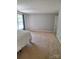 Spacious main bedroom with carpet flooring and a bright window at 7113 Sycamore Grove Ct, Charlotte, NC 28227
