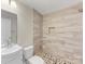 Updated bathroom features a tiled shower with mosaic flooring, modern fixtures, and a stylish vanity at 721 Broad St, Kannapolis, NC 28081