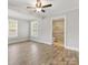 A bedroom with a view of the attached en-suite bathroom and natural light at 721 Broad St, Kannapolis, NC 28081