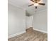 Bright bedroom with vinyl flooring, neutral walls, and a connecting doorway at 721 Broad St, Kannapolis, NC 28081