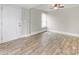 Bedroom with hardwood floors, large window, and neutral walls at 721 Broad St, Kannapolis, NC 28081