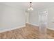 Dining room with hardwood floors and views into the living room and kitchen at 721 Broad St, Kannapolis, NC 28081