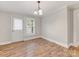 Dining room featuring hardwood floors and a door leading to the exterior at 721 Broad St, Kannapolis, NC 28081