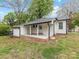 Charming exterior shows a quaint ranch home with a covered front porch at 721 Broad St, Kannapolis, NC 28081
