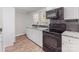 Updated kitchen showcases granite countertops, subway tile backsplash, and new black stainless steel appliances at 721 Broad St, Kannapolis, NC 28081