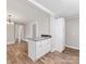 Open-concept kitchen island features granite countertops and flows into the dining and living areas at 721 Broad St, Kannapolis, NC 28081