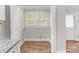 A neutral laundry room is sunlit by a double window and features vinyl flooring and a bright, inviting space at 721 Broad St, Kannapolis, NC 28081