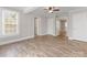 Bright and spacious living room with vinyl flooring, neutral walls, and large windows at 721 Broad St, Kannapolis, NC 28081