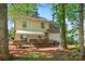 Charming backyard with a wood deck, picnic table, and manicured landscaping at 7220 Spring Morning Ln, Charlotte, NC 28227
