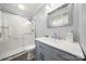A well-lit bathroom with modern fixtures, a glass enclosed shower, and vanity at 7220 Spring Morning Ln, Charlotte, NC 28227