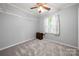 This bedroom has soft carpet, a window, and a neutral wall color at 7220 Spring Morning Ln, Charlotte, NC 28227