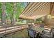 Beautiful backyard patio with an awning, providing shade and a relaxing outdoor space at 7220 Spring Morning Ln, Charlotte, NC 28227