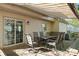 Inviting covered patio with outdoor seating, perfect for relaxing and entertaining guests at 7220 Spring Morning Ln, Charlotte, NC 28227