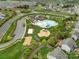 Aerial view showing community pool, playground, and other neighborhood features at 7362 Waterwheel Sw St # 280, Concord, NC 28025