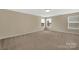 Bedroom with neutral carpet, natural light, and plenty of space at 7362 Waterwheel Sw St # 280, Concord, NC 28025