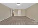 Spacious bonus room with neutral walls, carpet, and recessed lighting at 7362 Waterwheel Sw St # 280, Concord, NC 28025