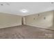 Spacious bonus room with neutral walls, carpet, and recessed lighting at 7362 Waterwheel Sw St # 280, Concord, NC 28025