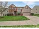 Inviting two-story home with a well-manicured lawn, complemented by tasteful landscaping and a welcoming entrance at 7362 Waterwheel Sw St # 280, Concord, NC 28025