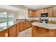 Open kitchen featuring granite countertops, stainless appliances and eat-in island at 7362 Waterwheel Sw St # 280, Concord, NC 28025