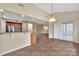 Open-concept kitchen and dining area with peninsula and sliding glass door at 7362 Waterwheel Sw St # 280, Concord, NC 28025