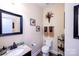 Elegant half-bathroom with stylish mirror and vanity, decorative wall art, and modern fixtures at 739 Ivy Trail Way, Fort Mill, SC 29715