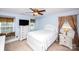 This inviting bedroom features a cozy window bench, ceiling fan, and ample natural light at 739 Ivy Trail Way, Fort Mill, SC 29715
