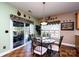 Charming dining area with unique decor, a sliding door with outside patio access, and warm color accents at 739 Ivy Trail Way, Fort Mill, SC 29715
