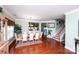 Formal dining room with hardwood floors, large table with seating for eight and stairs at 739 Ivy Trail Way, Fort Mill, SC 29715