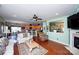 Open-concept living area connects the kitchen and living room with hardwood floors and natural light at 739 Ivy Trail Way, Fort Mill, SC 29715