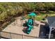 Aerial view of a community playground with a climbing structure, slide, and swing set at 739 Ivy Trail Way, Fort Mill, SC 29715