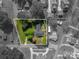 Aerial view showcasing approximate lot lines of the property surrounded by greenery and neighborhood houses at 821 Mark St, Belmont, NC 28012