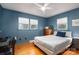 Stylish bedroom with natural light, wood floors, and serene blue accents at 821 Mark St, Belmont, NC 28012