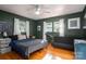 Comfortable bedroom with hardwood floors, neutral tones, and ample natural light at 821 Mark St, Belmont, NC 28012