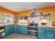 Well-appointed kitchen with modern appliances, butcher block counters, and unique tile backsplash at 821 Mark St, Belmont, NC 28012