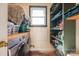 Bright laundry room with a front loading washer and dryer, storage shelves and plenty of counter space at 821 Mark St, Belmont, NC 28012