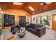 Relax in this cozy living room with hardwood ceiling, skylights, and neutral decor at 821 Mark St, Belmont, NC 28012