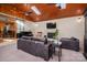 Living room boasts hardwood ceiling, brick fireplace, and lots of natural light at 821 Mark St, Belmont, NC 28012